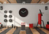Domowa siłownia – czerwono-czarny sprzęt do ćwiczeń na panelach podłogowych
